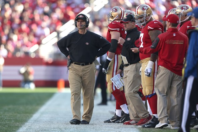 SANTA CLARA, CA - DECEMBER 28: head coach Jim Harbaugh of the San Francisco 49ers  watches a touchdown from the Arizona Cardinals in the first quarter at Levi's Stadium on December 28, 2014 in Santa Clara, California.  (Photo by Don Feria/Getty Images)