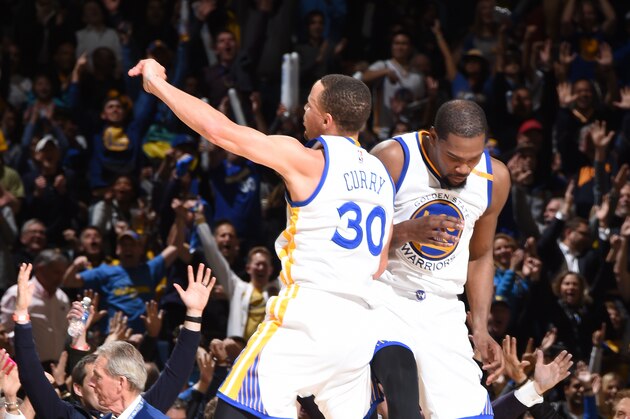 OAKLAND, CA - FEBRUARY 23: Stephen Curry #30 and Kevin Durant #35 of the Golden State Warriors reacts to a play against the LA Clippers during the game on February 23, 2017 at ORACLE Arena in Oakland, California. NOTE TO USER: User expressly acknowledges and agrees that, by downloading and/or using this Photograph, user is consenting to the terms and conditions of the Getty Images License Agreement. Mandatory Copyright Notice: Copyright 2017 NBAE (Photo by Andrew D. Bernstein/NBAE via Getty Images)