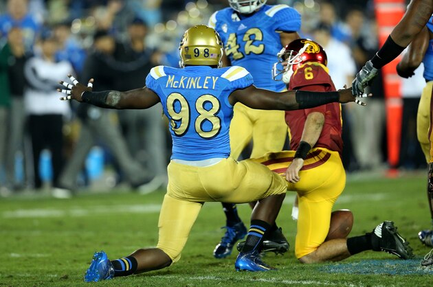 PASADENA, CA - NOVEMBER 22:  Takkarist McKinley #98 of the UCLA Bruins celebrates after sacking quarterback Cody Kessler #6 of the USC Trojans in the third quarter at the Rose Bowl on November 22, 2014 in Pasadena, California.   UCLA on 38-20.  (Photo by Stephen Dunn/Getty Images)