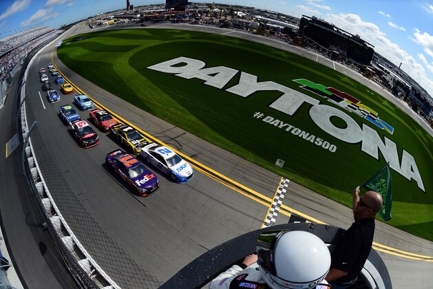 DAYTONA BEACH, FL - FEBRUARY 19:  Brad Keselowski, driver of the #2 SKF Ford, and Denny Hamlin, driver of the #11 FedEx Express Toyota, lead the field past the green flag to start the weather delayed Monster Energy NASCAR Cup Series Advance Auto Parts Clash at Daytona International Speedway on February 19, 2017 in Daytona Beach, Florida.  (Photo by Jared C. Tilton/Getty Images)