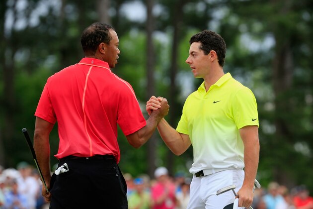 AUGUSTA, GA - APRIL 12:  Tiger Woods of the United States and Rory McIlroy of Northern Ireland shake hands on the 18th green during the final round of the 2015 Masters Tournament at Augusta National Golf Club on April 12, 2015 in Augusta, Georgia.  (Photo by Jamie Squire/Getty Images)