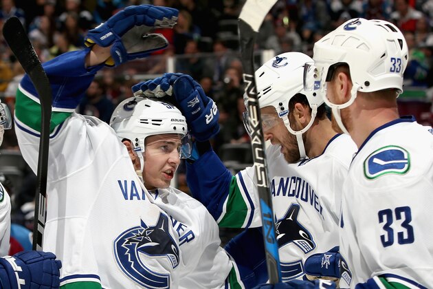 DENVER, CO - JANUARY 25:  Troy Stecher #51 of the Vancouver Canucks celebrates with Daniel Sedin #22 and Henrik Sedin #33 the go ahead goal in the third period against the Colorado Avalanche at the Pepsi Center on January 25, 2017 in Denver, Colorado.  (Photo by Matthew Stockman/Getty Images)