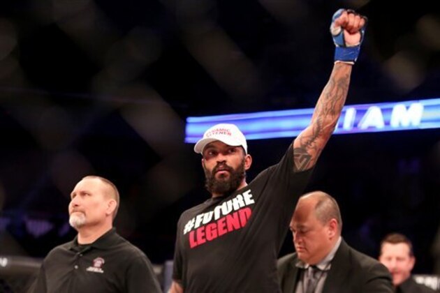 Liam McGeary is declared the victor after his light heavyweight title fight against Emanuel Newton at Bellator 134 on Friday, Feb. 27, 2015, in Uncasville, CT.  McGeary won the fight via decision. (AP Photo/Gregory Payan)