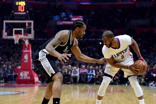 LOS ANGELES, CA - FEBRUARY 24:  Chris Paul #3 of the LA Clippers is guarded by Kawhi Leonard #2 of the San Antonio Spurs during the first half at Staples Center on February 24, 2017 in Los Angeles, California.  NOTE TO USER: User expressly acknowledges and agrees that, by downloading and or using this photograph, User is consenting to the terms and conditions of the Getty Images License Agreement.  (Photo by Harry How/Getty Images)
