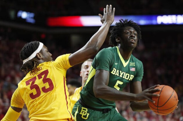 Baylor forward Johnathan Motley drives to the basket past Iowa State forward Solomon Young, left, during the first half of an NCAA college basketball game, Saturday, Feb. 25, 2017, in Ames, Iowa. (AP Photo/Charlie Neibergall)