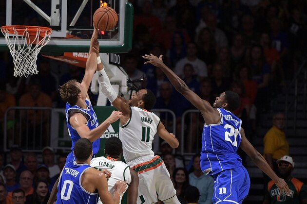 CORAL GABLES, FL - FEBRUARY 25: Luke Kennard #5 of the Duke Blue Devils blocks a shot by Bruce Brown #11 of the Miami Hurricanes at Watsco Center on February 25, 2017 in Coral Gables, Florida. (Photo by Lance King/Getty Images)