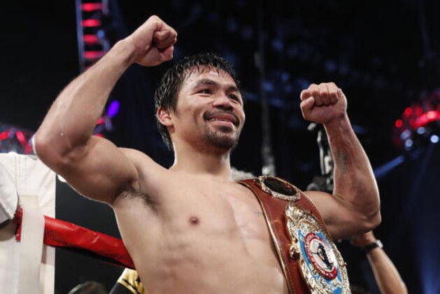 Manny Pacquiao, of the Philippines, celebrates after defeating Jessie Vargas in their WBO welterweight title boxing match, Saturday, Nov. 5, 2016, in Las Vegas. (AP Photo/Isaac Brekken)