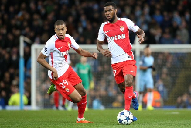 MANCHESTER, ENGLAND - FEBRUARY 21: Thomas Lemar of Monaco and Kylian Mbappe (left) in action during the UEFA Champions League Round of 16 first leg match between Manchester City FC and AS Monaco at Etihad Stadium on February 21, 2017 in Manchester, United Kingdom. (Photo by Jean Catuffe/Getty Images)