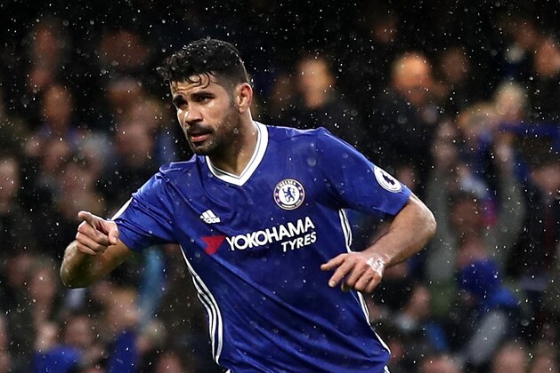 LONDON, ENGLAND - FEBRUARY 25: Diego Costa of Chelsea celebrates scoring his sides third goal during the Premier League match between Chelsea and Swansea City at Stamford Bridge on February 25, 2017 in London, England.  (Photo by Bryn Lennon/Getty Images)