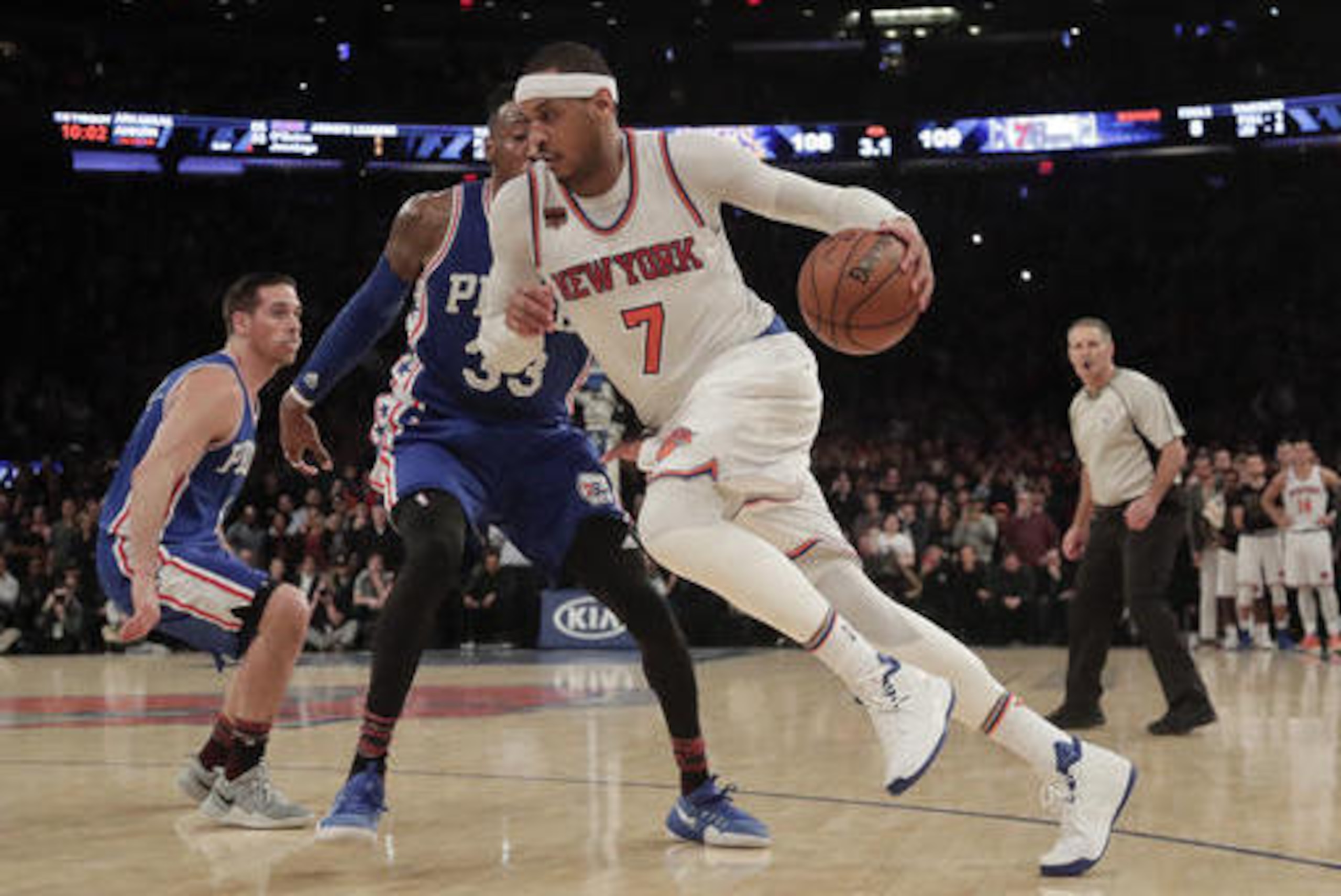 New York Knicks forward Carmelo Anthony (7) drives the ball against Philadelphia 76ers forward Robert Covington (33) during the fourth quarter of an NBA basketball game, Saturday, Feb. 25, 2017, in New York. (AP Photo/Julie Jacobson)