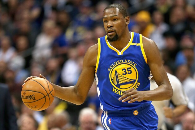 DENVER, CO - FEBRUARY 13: Kevin Durant #35 of the Golden State Warriors brings the ball down court against the Denver Nuggets at the Pepsi Center on February 13, 2017 in Denver, Colorado. NOTE TO USER: User expressly acknowledges and agrees that , by downloading and or using this photograph, User is consenting to the terms and conditions of the Getty Images License Agreement.  (Photo by Matthew Stockman/Getty Images)