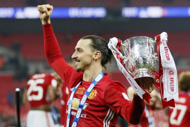 United's Zlatan Ibrahimovic celebrate with the trophy after winning the English League Cup final soccer match between Manchester United and Southampton FC at Wembley stadium in London, Sunday, Feb. 26, 2017. (AP Photo/Kirsty Wigglesworth)
