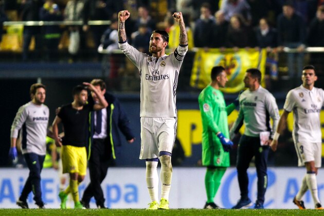 Real Madrid's defender, Sergio Ramos, celebrates at the end of the Spanish League football match Villarreal CF vs Real Madrid at El Madrigal stadium in Vila-real on February 26, 2017.  / AFP / BIEL ALINO        (Photo credit should read BIEL ALINO/AFP/Getty Images)
