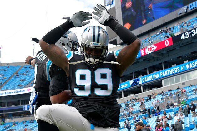 CHARLOTTE, NC - NOVEMBER 13: Kawann Short #99 is greeted by teammate Cam Newton #1 of the Carolina Panthers on the field before their game against the Kansas City Chiefs at Bank of America Stadium on November 13, 2016 in Charlotte, North Carolina.  (Photo by Grant Halverson/Getty Images)