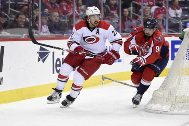 Washington Capitals left wing Marcus Johansson (90), of Sweden, loses his stick against Carolina Hurricanes defenseman Justin Faulk (27) during the first period of an NHL hockey game, Monday, Jan. 23, 2017, in Washington. (AP Photo/Nick Wass) Washington Capitals left wing Marcus Johansson (90), of Sweden, loses his stick against Carolina Hurricanes defenseman Justin Faulk (27) during the first period of an NHL hockey game, Monday, Jan. 23, 2017, in Washington. (AP Photo/Nick Wass)