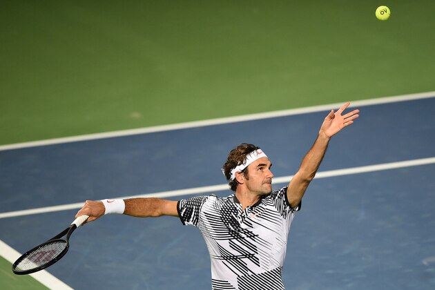 DUBAI, UNITED ARAB EMIRATES - FEBRUARY 27:  Roger Federer of Switzerland serves during his match against Benoit Paire of France on day two of the ATP Dubai Duty Free Tennis Championship on February 27, 2017 in Dubai, United Arab Emirates.  (Photo by Tom Dulat/Getty Images)