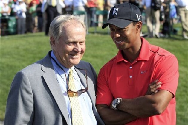 Jack Nicklaus, left, talks with Tiger Woods after Woods won the Memorial golf tournament at the Muirfield Village Golf Club in Dublin, Ohio, Sunday, June 3, 2012. (AP Photo/Tony Dejak)
