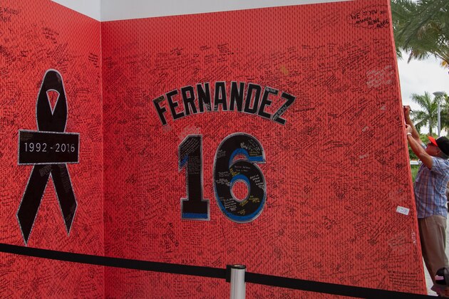 MIAMI, FL - SEPTEMBER 28:  Atmosphere at a memorial before the hearse carrying Miami Marlins pitcher Jose Fernandez passes in front of the Marlins baseball stadium on September 28, 2016 in Miami, Florida. Mr. Fernandez was killed in a weekend boat crash in Miami Beach along with two friendsSeptember 28, 2016 in Miami, Florida.  (Photo by John Parra/Getty Images)