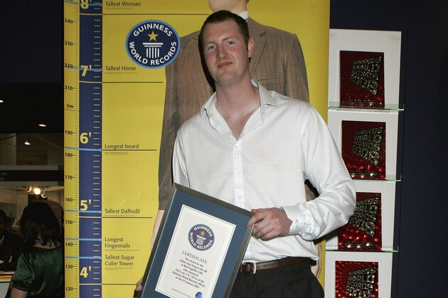 LONDON - APRIL 16:  Neil Fingleton, Britain's tallest man is presented with the Guinness World Record for being Britains tallest man at The London Book Fair on April 16, 2007 in London, England. Fingleton is 232.5 cms high or 7ft 7.56 inches. (Photo by Chris Jackson/Getty Images)