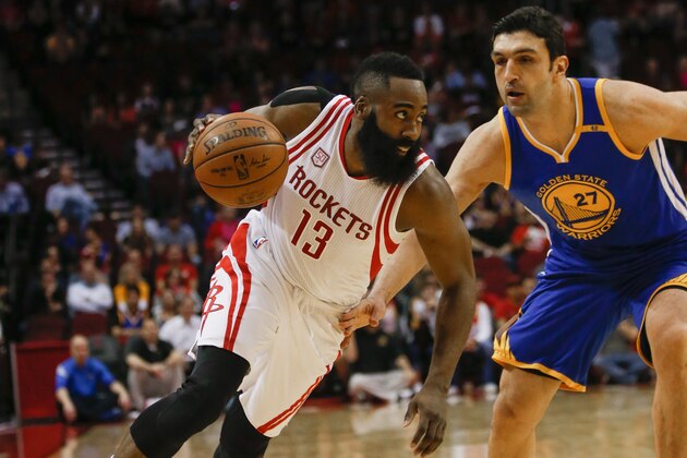 HOUSTON, TX - JANUARY 20:  James Harden #13 of the Houston Rockets drives around Zaza Pachulia #27 of the Golden State Warriors in the first quarter at Toyota Center on January 20, 2017 in Houston, Texas.  NOTE TO USER: User expressly acknowledges and agrees that, by downloading and/or using this photograph, user is consenting to the terms and conditions of the Getty Images License Agreement.  (Photo by Bob Levey/Getty Images)