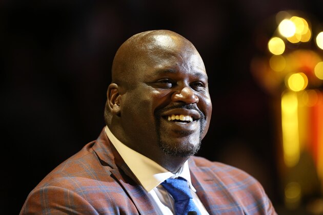 MIAMI, FL - DECEMBER 22:  NBA Legend Shaquille O'Neal looks on with the championship trophy in the background at his number retirement ceremony on December 22, 2016 at American Airlines Arena in Miami, Florida. NOTE TO USER: User expressly acknowledges and agrees that, by downloading and/or using this photograph, user is consenting to the terms and conditions of the Getty Images License Agreement. Mandatory Copyright Notice: Copyright 2016 NBAE (Photo by Joe Murphy/NBAE via Getty Images)