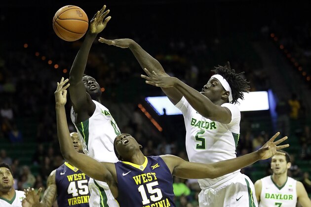 WACO, TX - FEBRUARY 27:  Lamont West #15 of the West Virginia Mountaineers loses the ball against Jo Lual-Acuil Jr. #0 and Johnathan Motley #5 of the Baylor Bears in the first half at Ferrell Center on February 27, 2017 in Waco, Texas.  (Photo by Ronald Martinez/Getty Images)