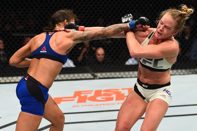 BROOKLYN, NEW YORK - FEBRUARY 11:  (L-R) Germaine de Randamie of The Netherlands punches Holly Holm in their women's featherweight championship bout during the UFC 208 event inside Barclays Center on February 11, 2017 in Brooklyn, New York. (Photo by Jeff Bottari/Zuffa LLC/Zuffa LLC via Getty Images)