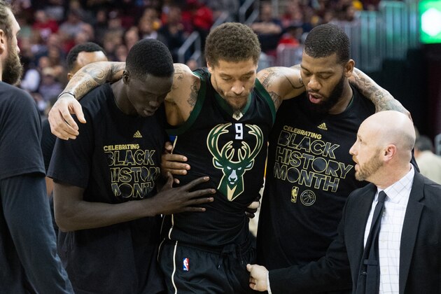CLEVELAND, OH - FEBRUARY 27: Thon Maker #7 and Greg Monroe #15 help Michael Beasley #9 of the Milwaukee Bucks off the court after Beasley was injured during the first half against the Cleveland Cavaliers at Quicken Loans Arena on February 27, 2017 in Cleveland, Ohio. NOTE TO USER: User expressly acknowledges and agrees that, by downloading and/or using this photograph, user is consenting to the terms and conditions of the Getty Images License Agreement. (Photo by Jason Miller/Getty Images)