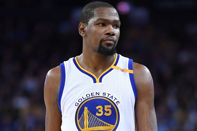 OAKLAND, CA - FEBRUARY 15:  Kevin Durant #35 of the Golden State Warriors looks on during a timeout during an NBA Basketball game against the Sacramento Kings at ORACLE Arena on February 15, 2017 in Oakland, California. NOTE TO USER: User expressly acknowledges and agrees that, by downloading and or using this photograph, User is consenting to the terms and conditions of the Getty Images License Agreement.  (Photo by Thearon W. Henderson/Getty Images)