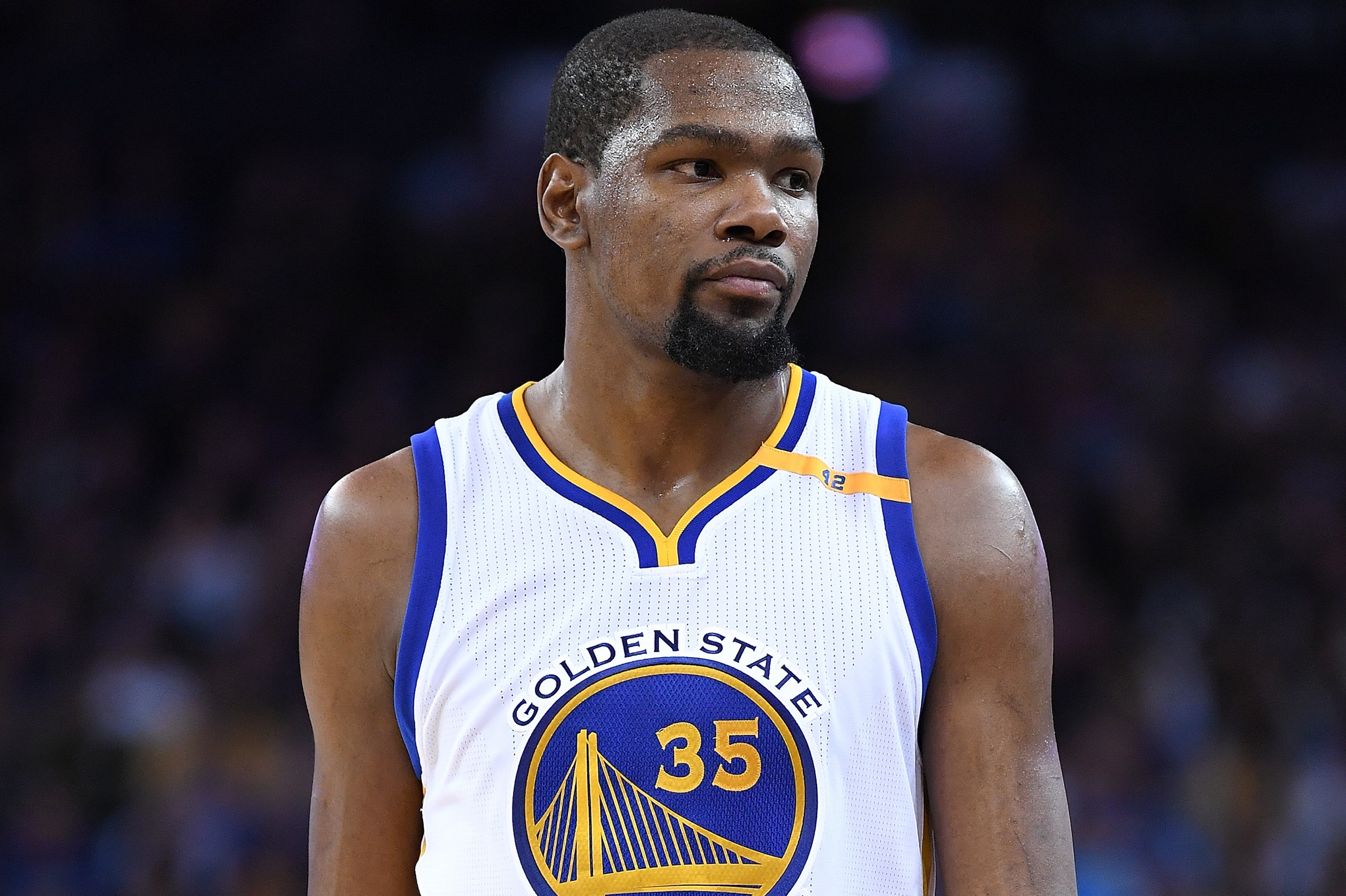 OAKLAND, CA - FEBRUARY 15:  Kevin Durant #35 of the Golden State Warriors looks on during a timeout during an NBA Basketball game against the Sacramento Kings at ORACLE Arena on February 15, 2017 in Oakland, California. NOTE TO USER: User expressly acknowledges and agrees that, by downloading and or using this photograph, User is consenting to the terms and conditions of the Getty Images License Agreement.  (Photo by Thearon W. Henderson/Getty Images)