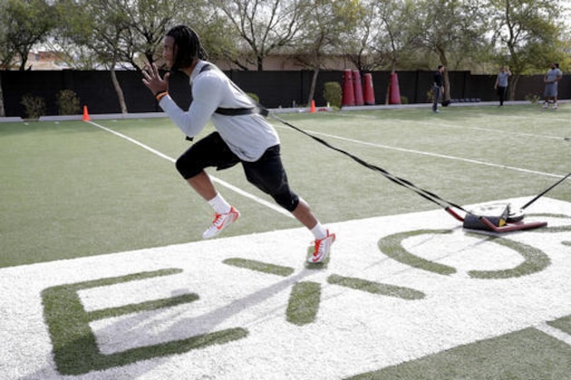 Former Clemson receiver Mike Williams runs drills, Monday, Feb. 13, 2017, in Phoenix during a football workout for the upcoming NFL combine. (AP Photo/Matt York)