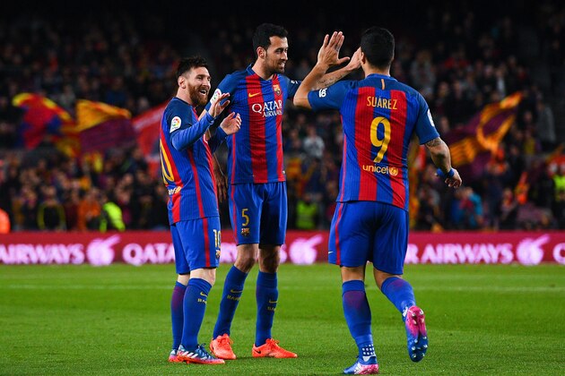 BARCELONA, SPAIN - MARCH 01:  Lionel Messi of FC Barcelona celebrates with his team mates Sergio Busquets and Luis Suarez of FC Barcelona after scoring the opening goal during the La Liga match between FC Barcelona and Real Sporting de Gijon at Camp Nou stadium on March 1, 2017 in Barcelona, Spain.  (Photo by David Ramos/Getty Images)