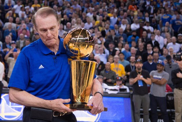 March 23, 2015; Oakland, CA, USA; Golden State Warriors former player Rick Barry holds the 1975 NBA Championship trophy during a 40th anniversary celebration during the game against the Washington Wizards at Oracle Arena. Mandatory Credit: Kyle Terada-USA TODAY Sports