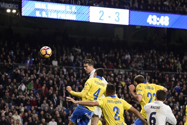 Real Madrid's Portuguese forward Cristiano Ronaldo (L) heads to score during the Spanish league football match Real Madrid CF vs UD Las Palmas at the Santiago Bernabeu stadium in Madrid on March 1, 2017. / AFP PHOTO / JAVIER SORIANO        (Photo credit should read JAVIER SORIANO/AFP/Getty Images)