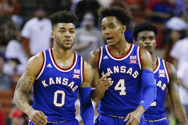 AUSTIN, TX - FEBRUARY 25: Frank Mason III #0 and Devonte' Graham #4 of the Kansas Jayhawks talk on court during the game with the Texas Longhorns at the Frank Erwin Center on February 25, 2017 in Austin, Texas. (Photo by Chris Covatta/Getty Images)