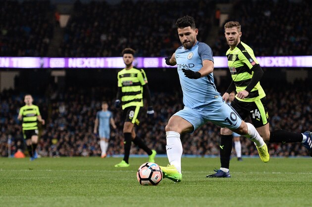 Manchester City's Argentinian striker Sergio Aguero shoots buts fails to score during the FA Cup fifth round replay football match between Manchester City and Huddersfield Town at the Etihad Stadium in Manchester, north west England, on March 1, 2017. / AFP PHOTO / Oli SCARFF / RESTRICTED TO EDITORIAL USE. No use with unauthorized audio, video, data, fixture lists, club/league logos or 'live' services. Online in-match use limited to 75 images, no video emulation. No use in betting, games or single club/league/player publications.  /         (Photo credit should read OLI SCARFF/AFP/Getty Images)