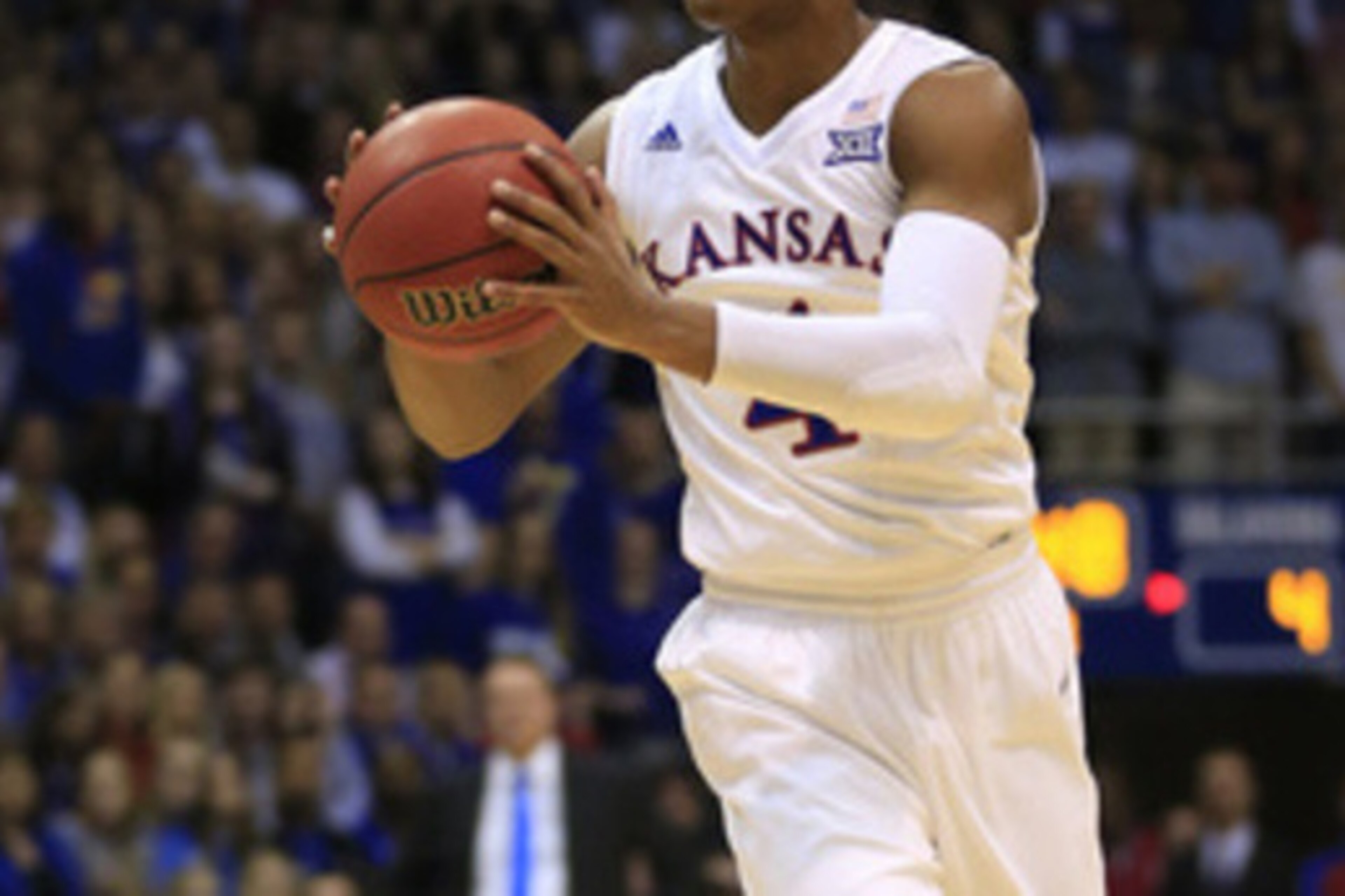 Kansas guard Devonte' Graham (4) during the first half of an NCAA college basketball game against Oklahoma in Lawrence, Kan., Monday, Feb. 27, 2017. (AP Photo/Orlin Wagner)