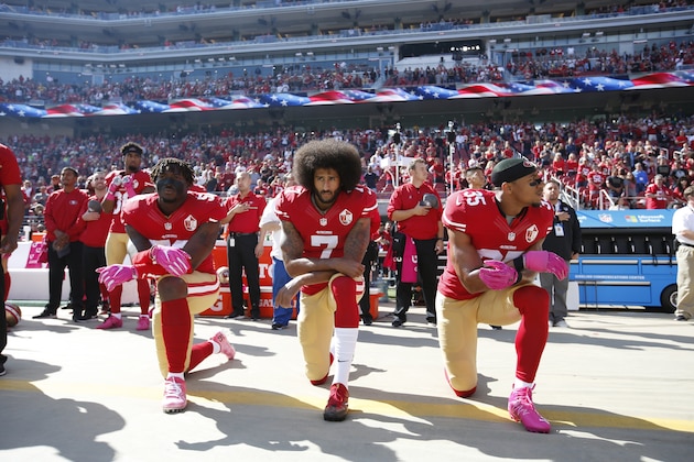 SANTA CLARA, CA - OCTOBER 23: Eli Harold #58, Colin Kaepernick #7 and Eric Reid #35 of the San Francisco 49ers kneel for the anthem prior to the game against the Tampa Bay Buccaneers at Levi Stadium on October 23, 2016 in Santa Clara, California. The Buccaneers defeated the 49ers 34-17. (Photo by Michael Zagaris/San Francisco 49ers/Getty Images)
