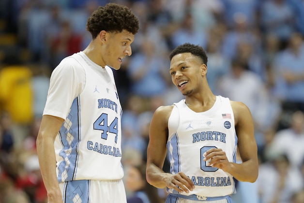 CHAPEL HILL, NC - FEBRUARY 22:  Teammates Justin Jackson #44 and Nate Britt #0 of the North Carolina Tar Heels talk during their game against the Louisville Cardinals at the Dean Smith Center on February 22, 2017 in Chapel Hill, North Carolina.  (Photo by Streeter Lecka/Getty Images)