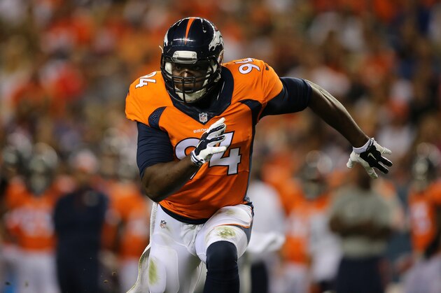 DENVER, CO - AUGUST 07:  Defensive end DeMarcus Ware #94 of the Denver Broncos rushes against the Seattle Seahawks during preseason action at Sports Authority Field at Mile High on August 7, 2014 in Denver, Colorado. The Broncos defeated the Seahawks 21-16.  (Photo by Doug Pensinger/Getty Images)