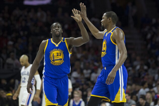 PHILADELPHIA, PA - FEBRUARY 27: Draymond Green #23 celebrates with Kevin Durant #35 of the Golden State Warriors in front of Gerald Henderson #12 of the Philadelphia 76ers in the second quarter at the Wells Fargo Center on February 27, 2017 in Philadelphia, Pennsylvania. The Warriors defeated the 76ers 119-108. NOTE TO USER: User expressly acknowledges and agrees that, by downloading and or using this photograph, User is consenting to the terms and conditions of the Getty Images License Agreement. (Photo by Mitchell Leff/Getty Images)