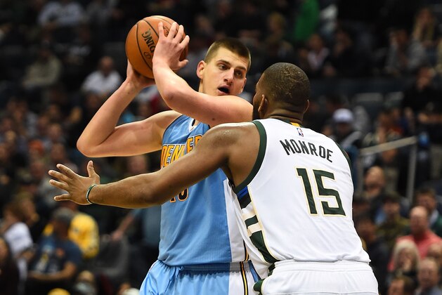 MILWAUKEE, WI - MARCH 01:  Nikola Jokic #15 of the Denver Nuggets works against Greg Monroe #15 of the Milwaukee Bucks during a game at the BMO Harris Bradley Center on March 1, 2017 in Milwaukee, Wisconsin.  NOTE TO USER: User expressly acknowledges and agrees that, by downloading and or using this photograph, User is consenting to the terms and conditions of the Getty Images License Agreement.  (Photo by Stacy Revere/Getty Images)