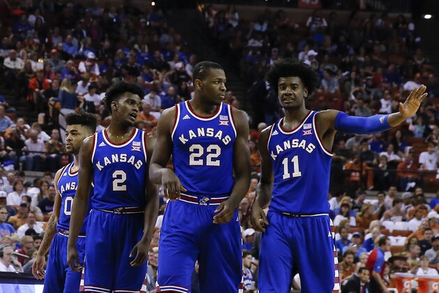 AUSTIN, TX - FEBRUARY 25: Frank Mason III #0, Lagerald Vick #2, Dwight Coleby #22 and Josh Jackson #11 of the Kansas Jayhawks stand on the court against the Texas Longhorns at the Frank Erwin Center on February 25, 2017 in Austin, Texas. (Photo by Chris Covatta/Getty Images)
