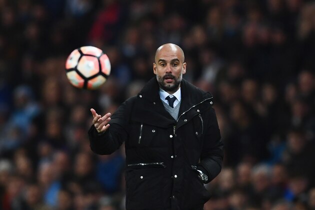 MANCHESTER, ENGLAND - MARCH 01:  Josep Guardiola manager of Manchester City throws the ball during The Emirates FA Cup Fifth Round Replay match between Manchester City and Huddersfield Town at Etihad Stadium on March 1, 2017 in Manchester, England.  (Photo by Laurence Griffiths/Getty Images)