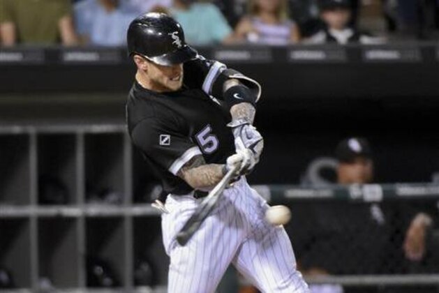 Chicago White Sox's Brett Lawrie grounds into a force out, scoring Melky Cabraera during the sixth inning of a baseball game against the New York Yankees in Chicago on Wednesday, July 6, 2016. (AP Photo/Matt Marton)