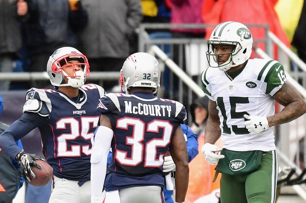 FOXBORO, MA - DECEMBER 24:  Eric Rowe #25 of the New England Patriots reacts with Devin McCourty #32 after intercepting a pass intended for Brandon Marshall #15 of the New York Jets during the second quarter of a game at Gillette Stadium on December 24, 2016 in Foxboro, Massachusetts.  (Photo by Billie Weiss/Getty Images)