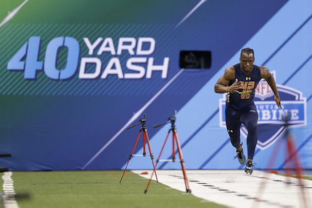 Washington wide receiver John Ross runs the 40-yard dash at the NFL football scouting combine in Indianapolis, Saturday, March 4, 2017. (AP Photo/Michael Conroy)