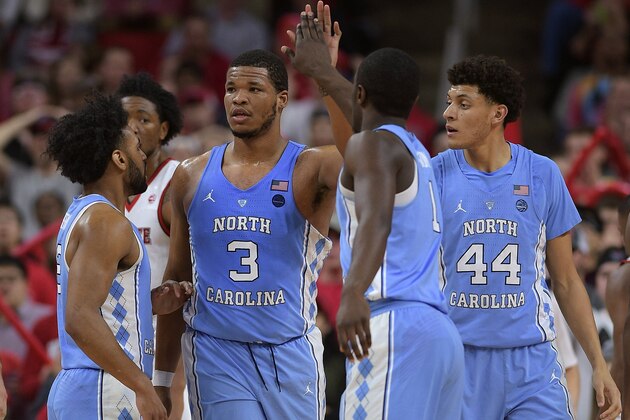RALEIGH, NC - FEBRUARY 15: Joel Berry II #2, Kennedy Meeks #3, Theo Pinson #1 and Justin Jackson #44 of the North Carolina Tar Heels react during their game against the North Carolina State Wolfpack at PNC Arena on February 15, 2017 in Raleigh, North Carolina. (Photo by Lance King/Getty Images)