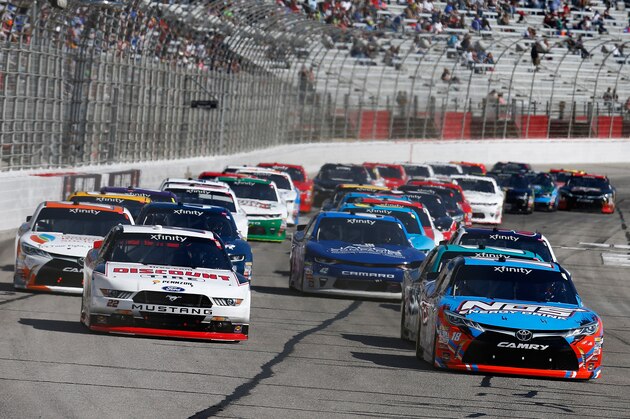 HAMPTON, GA - MARCH 04:  Kyle Busch, driver of the #18 NOS Energy Drink Toyota, and Brad Keselowski, driver of the #22 Discount Tire Ford, lead a pack of cars during the NASCAR XFINITY Series Rinnai 250 at Atlanta Motor Speedway on March 4, 2017 in Hampton, Georgia.  (Photo by Daniel Shirey/Getty Images)