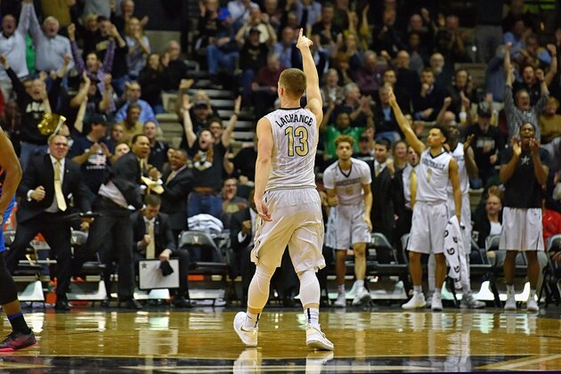 NASHVILLE, TN - MARCH 04: Fans and players cheer as Riley Lachance #13 of the Vanderbilt Commodores holds up a finger to celebrate during the final moments of the second half of a 73-71 Vanderbilt upset over Florida at Memorial Gym on March 4, 2017 in Nashville, Tennessee. (Photo by Frederick Breedon/Getty Images) NASHVILLE, TN - MARCH 04: Fans and players cheer as Riley Lachance #13 of the Vanderbilt Commodores holds up a finger to celebrate during the final moments of the second half of a 73-71 Vanderbilt upset over Florida at Memorial Gym on March 4, 2017 in Nashville, Tennessee. (Photo by Frederick Breedon/Getty Images)